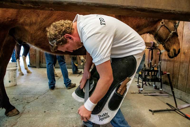 Travis Burns competing at the World Horseshoeing Classic farrier competition