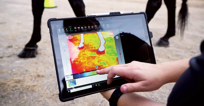 Rebecca-Nanney-calibrates-a-thermography-camera-during-a-horse-show.jpg